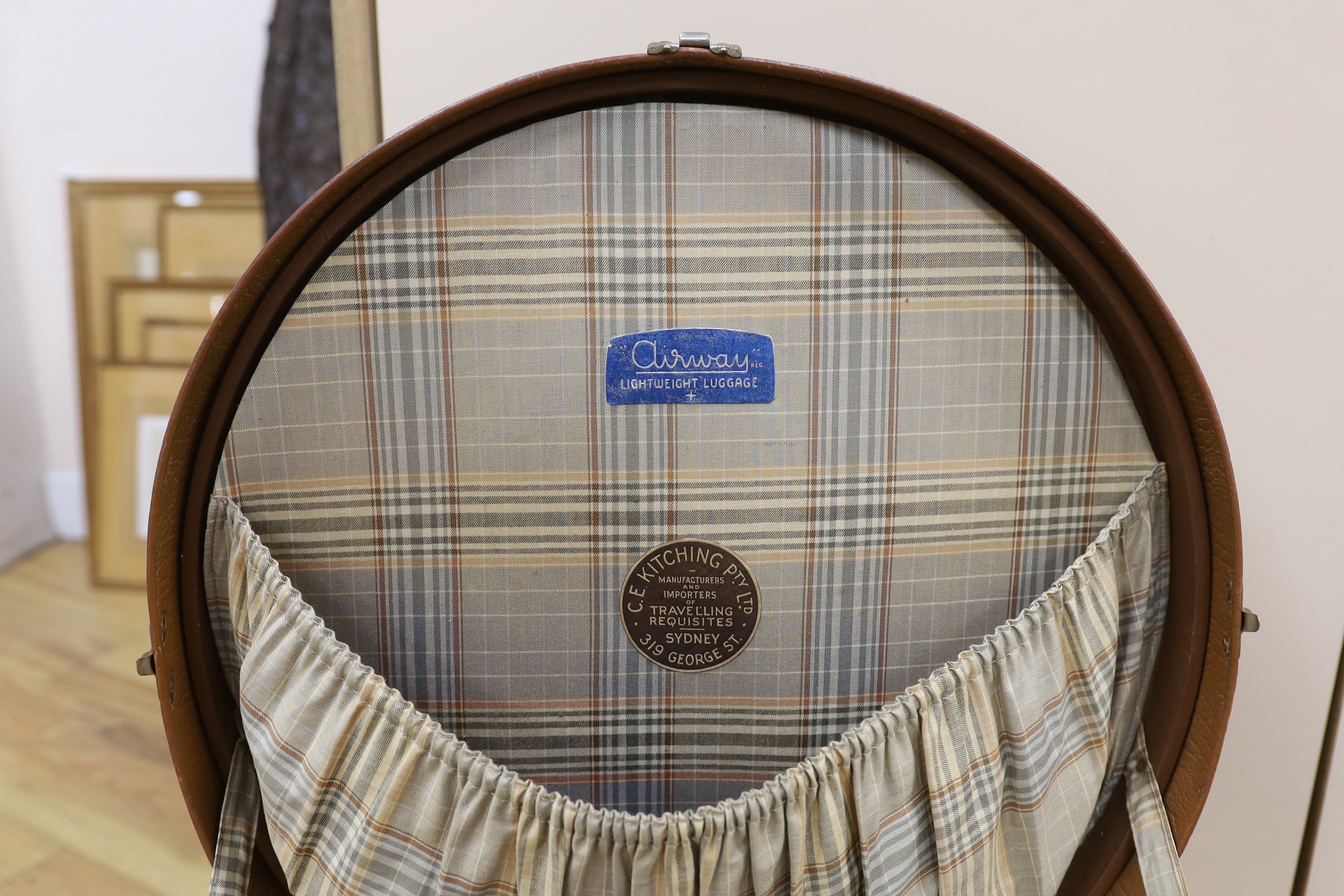 A circular Harrods branded hat box and a larger gents brown leather hat box, Harrods box 36cm diameter